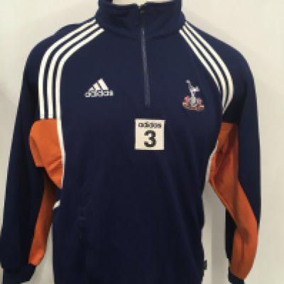 Tottenham 2000 - 2001 Player Issue Training Top + Track Suit: Worn by Mauricio Taricco consisting of a white Adidas Holsten short sleeve top with number 3 stitched to front. Tottenham Adidas tracksuit with number 3 also stitched to both bottoms and top. Both garments having orange trim.