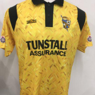 92/93 Port Vale Match Worn Football Shirt: Yellow short sleeve with Tunstall Assurance sponsor and number 14 to rear. Excellent condition worn in promotion season and obtained originally by goalkeeper Trevor Wood from a team mate. Football League badging to sleeves.
