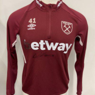 West Ham 2020 - 2021 Declan Rice Training Football Shirt: Claret long sleeve with B from Betway missing from front and signed underneath. Zip up neck top has number 41 above Umbro sign. Photo of Declan holding this shirt available to email.