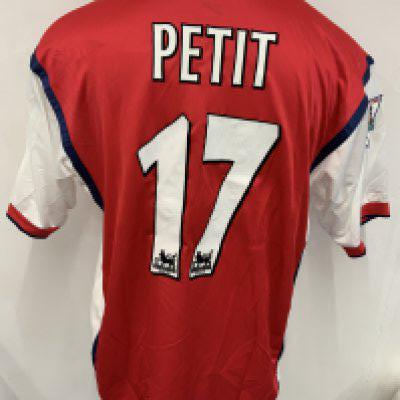 Arsenal 1998 - 1999 Match Worn Home Football Shirt: Short sleeve red home kit with Premier League badging to sleeve which states 1997;- 1998 Champions. Petit number 17 to rear. JVC sponsor. Signed COA stating I wore this shirt v Tottenham on September May 5th 1999. 2 press photos of him wearing this shirt.