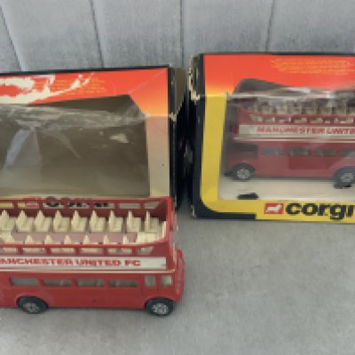 Manchester United Corgi Double Decker Buses: Two open top buses with Manchester United to both sides. Boxes present but damaged. Believed to be from mid 80s. (2)
