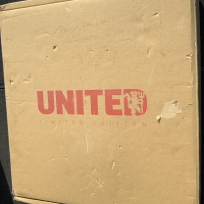 Manchester United Rare Opus Unopened Boxed Football Book: Limited edition stunning heavy book. We have not opened the book as its still sealed but online we have a stock photograph of the book as we did not want to remove it. Leather bound by hand printed on silk coated paper. Over 2000 images each individually varnished. 60 x 60 x 14 cm and an almost unliftable 37 kilos. This will undoubtedly be signed by Ferguson and Charlton and possibly others. We have been informed this cost 3k new.