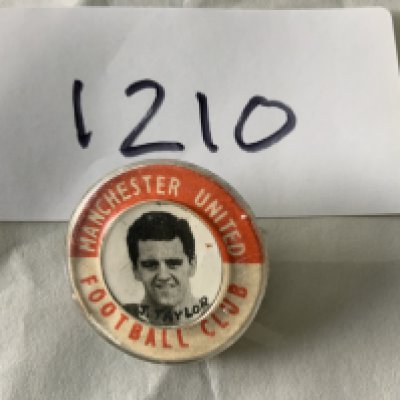 Manchester United Tommy Taylor Football Badge: Original pin badge of the great Busby Babe. Clip to hold pin to rear missing.