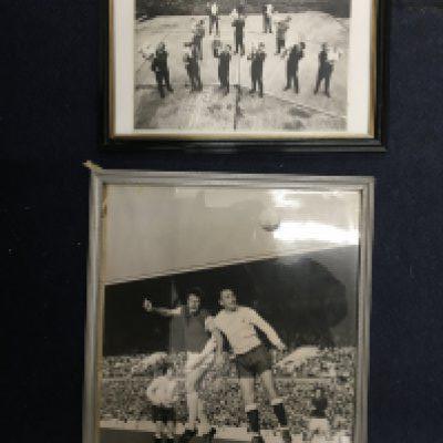 West Ham Framed Football Press Photos: 12 players all holding their babies in 1965. C/W a large action shot of Peter Eustace challenging Gilzean of Tottenham at Upton Park. Both have press stamps to rear and can be taken out of frames for sending. (2)