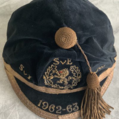 Denis Law Scotland + Manchester United Football Cap: Excellent condition cap awarded to Denis Law for playing v Ireland Wales and England in the Home Championships. 1962-63 to peak.