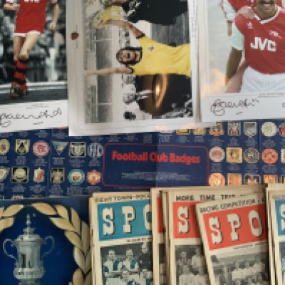 Football Memorabilia Box: Includes Arsenal Ltd edition prints signed by Rix and Sansom plus other signed photos, Esso complete coin and club badge set, 16 early 50s Sport magazines with football team groups to cover, programmes, Topical Times Miniature Portraits and more.
