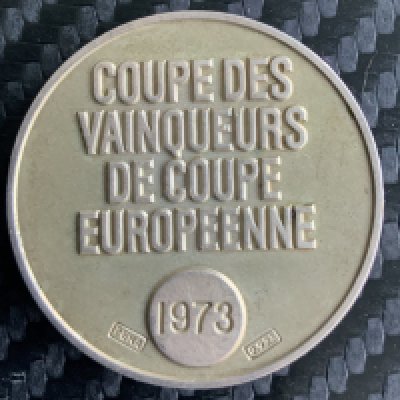 Leeds United 1973 ECWC Final Football Medal: Presented to Paul Madeley for being a runner up in the final v AC Milan in a still controversial match. Medal has UEFA beneath cup on one side with reverse reading Coupe Des Vainqueurs De Coupe Europeenne. COA signed by son.