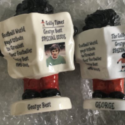 George Best Carlton Ware Football Figures: Two figures issued in 2005 as a tribute to him Ltd edition of 100 each issued by his agents. Depicts a Golly reading the Golly Times which has the tribute to George one in Northern Ireland kit the other in Manchester United kit. Certificates and boxes included. (2)