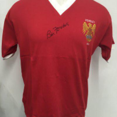 Manchester United 1958 FA Cup Final Signed Football Shirt: Red retro Man Utd shirt with Wembley 1958 either side of crest. Signed to front by winning captain Bill Foulkes with Coa from reputable source.