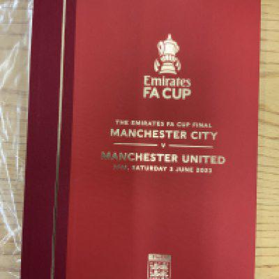 2023 Hardback FA Cup Final Football Programme: Manchester United v Manchester City Ltd edition number 543 of 555. Excellent condition bound in red cover with gold embossing.