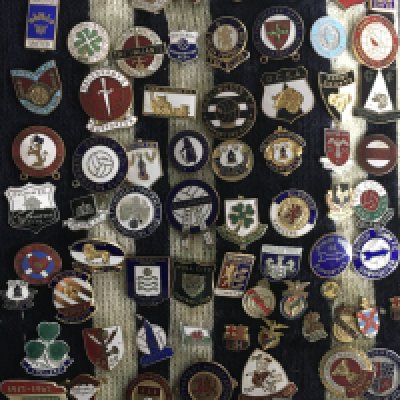 1960s Football Badge Collection: Superb collection of mainly football league teams from the 60s with plenty earlier. Some lovely old supporters club badges included. Collector has attached badges to a blue and white scarf. (192)
