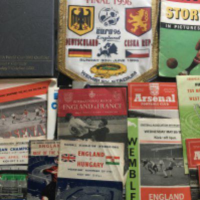 Football Memorabilia Box: Worth a look as wide range of nice items. Includes hardback version programme of last match at Wembley England v West Germany, Euro 96 pennant, big match programmes, Arsenal 47/48 championship brochure, 54/55 table decoration for match v Spartak, 1989 FA Cup final menu. C/W some big match tickets.