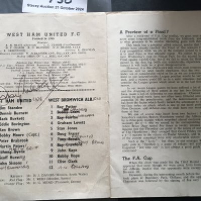 Moore Hurst + Peters Signed West Ham + England Football Items: West Ham home programme signed to team page by Bobby Moore. C/W label which could be used for a wine bottle signed by other World Cup winners Hurst and Peters.