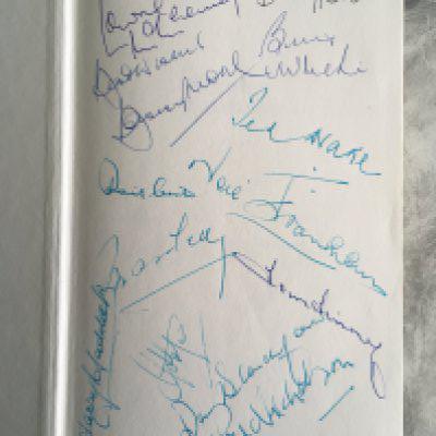 England Legends Signed Football Book: Do not miss this rare opportunity. Stanley Matthews 1989 book signed and dedicated by him. On another page is Lawrie McMenemy. On a blank first page some incredible names have signed who apart from Harry Haddock and Danny Blanchflower were Englands greatest players. Includes Bobby Moore Bobby Robson Bill Nicholson Neil Franklin Ted Drake Billy Wright and more.
