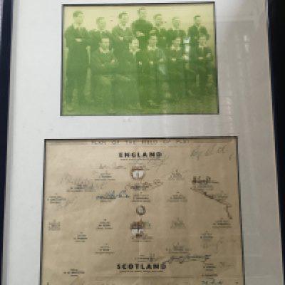 1949 England Football Team Framed Signed Display: Team page for match v Scotland signed by 10 England players and 7 Scottish players. Includes Wright Mortensen Matthews Finney of England and Young of Scotland. Framed with picture of the England team.