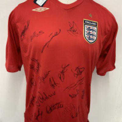 England World Cup 2006 Signed Football Shirt: Red away shirt in size XL brand new with tags. Given to major sponsor who attended the tournament. Signed clearly to front by 21 including Gerrard Owen and Beckham.