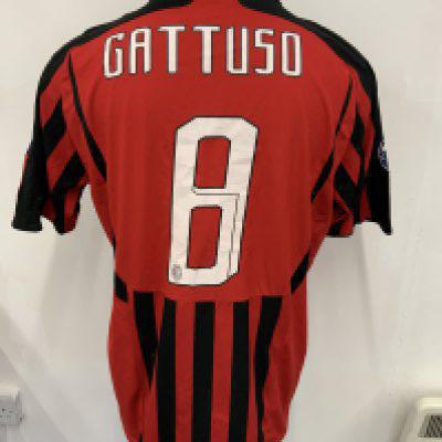 Gatuso AC Milan Match Worn Football Shirt: Red and black short sleeve home shirt worn in 2007 - 2008 v Arsenal. Champions League sleeve patches with 7 representing wins in the competition and the other stating Champions 06/07. Number 8 Gatuso to rear. Swapped with Kolo Toure on 20 2 2008. This shirt has to front the gold FIFA Champions 2007 badge to front.