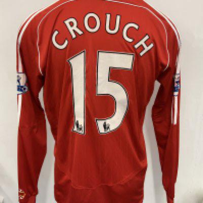 Peter Crouch Liverpool 2006 - 2008 Match Worn Football Shirt: Red long sleeve home shirt worn v Arsenal. Premier League sleeve patches to arms of which one is peeling slightly. Number 15 Crouch to rear. Swapped with Kolo Toure.