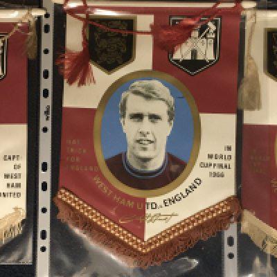 West Ham Coffer 1966 World Cup Football Pennants: Hurst Moore and Peters in West Ham kit. All state 1966 World Cup Final. Original top sheaf hanging bars are still intact. (3)