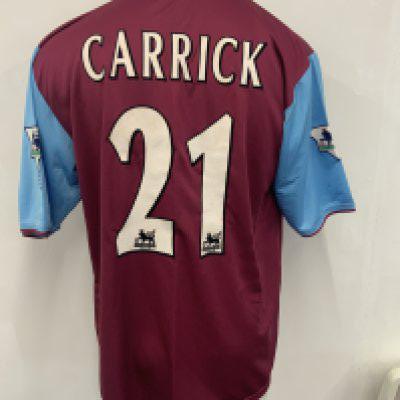West Ham 2001 - 2002 Carrick Match Worn Football Shirt: Claret and blue short sleeve Fiola Dr Martens shirt with Carrick 21 to rear. Signed by around 20 team mates including Di Canio and Hislop. Worn v Aton Villa on 5 12 2001 and swapped with Paul Merson.