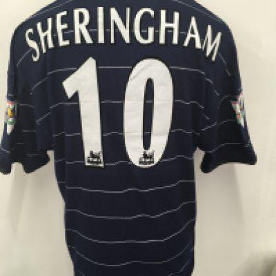 Manchester United 1999 - 2000 Sheringham Match Worn Football Shirt: Blue pin striped Umbro Sharp Digital short sleeve shirt. Sheringham number 10 to rear. Gold Champions 1998 - 1999 Premier League badging after winning the treble the season before. Worn on 14 5 2000 in which he scored the only goal v Aston Villa. Swapped with Paul Merson.