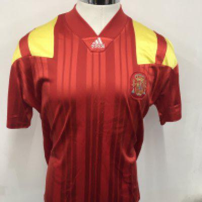 Spain 1992 Match Worn Football Shirt: Red short sleeve Adidas shirt with yellow trim. Number 8 to rear. Worn v England on 9 9 1992 by Michel and swapped with Paul Merson.