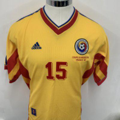 Rumania 1998 World Cup Match Worn Football Shirt: Yellow with blue and red trim short sleeve Adidas shirt. Front has number 15 and the words Coupe Du Monde FIFA France 98 below badge. Rear has number 15 Marinescu who came on as a sub v England. Swapped after match with Paul Merson.