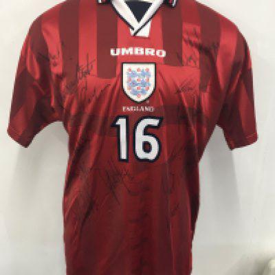 Paul Merson 1998 England Away Signed Match Worn Football Shirt: Red short sleeve away shirt with number 16 to rear. Worn by Merson v Sweden on 5 9 1998. Signed by 13 to front including himself.