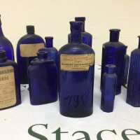 A collection of antique blue glass poison bottles and other tonic and medicine bottles. No Reserve.