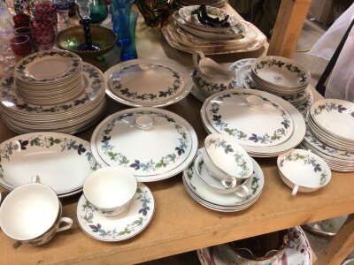 A Royal Doulton Porcelain dinner service The Burgundy pattern. Comprising tureens cups sauces soup bowls graduating plates dessert bowls sauce boat.- NO RESERVE