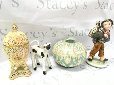Ceramics including a porcelain Austrian figure of a boy , mother of pearl glaze vase, Worcester lidded vase and a cow figure. 15 to 25cm tall