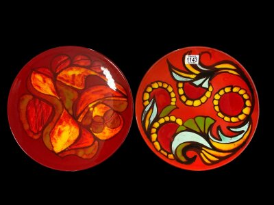A pair of large Poole pottery Delphis chargers., Each 35cm.
