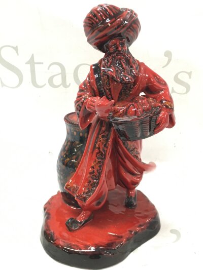 A Royal Doulton Flambé Lamp Seller figure, 24cm tall