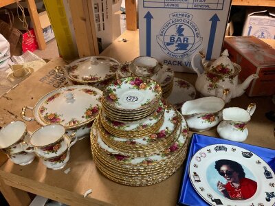A Royal Albert country rose tea dinner service including tureens tea pot milk jug serving plates .