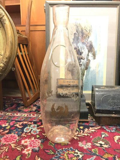 A large glass Tolly Cobbold vase. 62cm tall