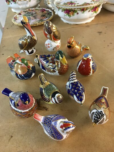 A collection of Royal Crown Derby paperweights in the form of birds including Pelican, Waxwing and Kingfisher- various sizes and all with stoppers