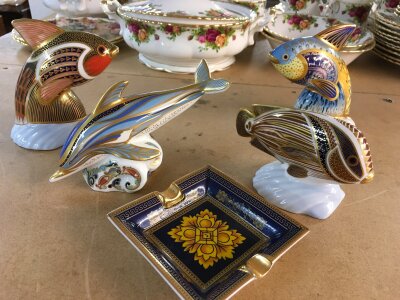 Four Royal Crown Derby paperweights in the form of marine animals including Dolphin, all with stoppers.  Together with a ceramic decorative ashtray