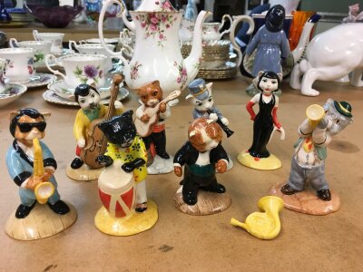 A collection of Beswick cat figures playing instruments