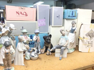 A collection of boxed Lladro and Nao figures and a Lenox German shepherd dog work (10)