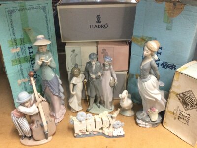 A collection of boxed Lladro and Nao figures