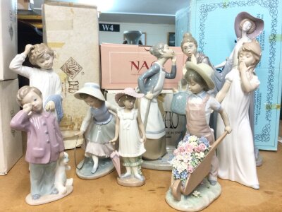 A collection of Lladro and Nao porcelain figures including Gossips, Girl with hoop , some boxed (8)