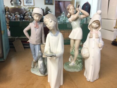 Four Lladro and Nao figures