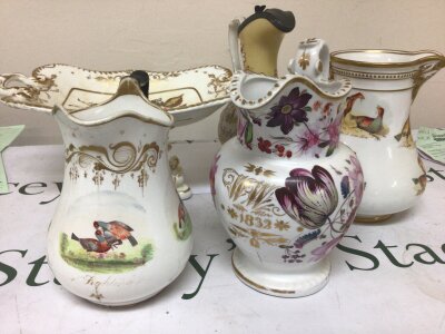 A collection of Victorian Porcelain including jugs hand painted with Cock fighting Scence a jug hand painted with flowers and foliage with gilt initials and date 1832. Some with cracks