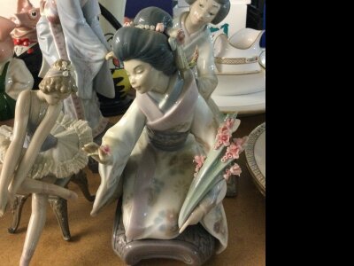 A collection of Lladro figures including geisha