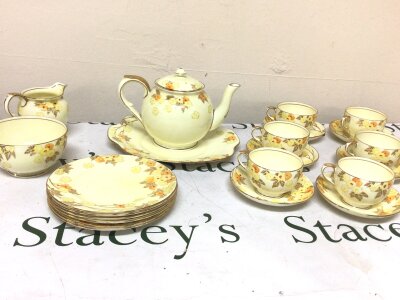 A Crown Staffordshire porcelain tea set six place setting with a yellow floral pattern no obvious damage.