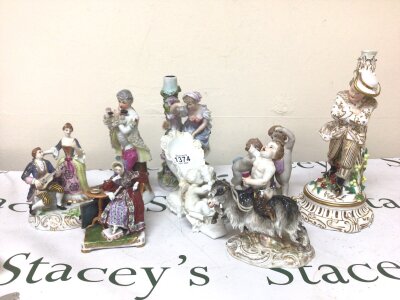 A Collection of 19th century and later Continental porcelain figures including a damaged Meissen figure a putti seated on a goat a white glazed shoe with cherubs and other's.