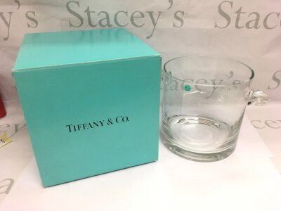 A boxed Tiffany & Co crystal ice bucket and various glass decanters and stoppers.