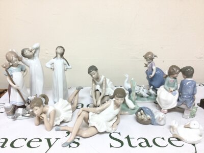 A collection of Lladro and Nao porcelain figures
