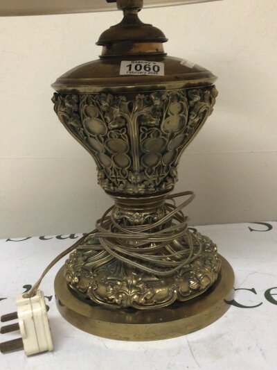 A quality Victorian oxidised and lacquered brass oil lamp of Gothic design later converted to a lamp the reservoir with raised tracery. Height 50cm- NO RESERVE
