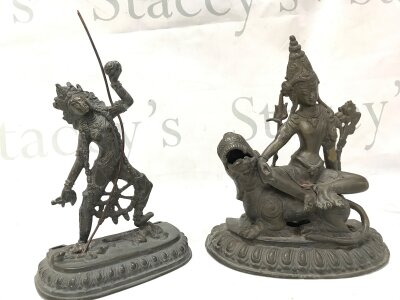 Two Bronze Tibetan figures - Simhanada Manjushri the Bodhisattva of Knowledge seated upon a roaring lion and the Buddhist tantric deity Vajrayogini . 19 and 22cm tall- NO RESERVE